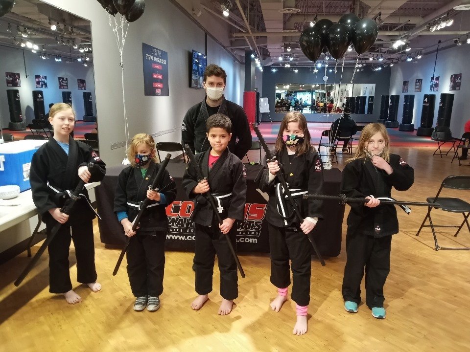 Child listening intently during karate class in Lapeer