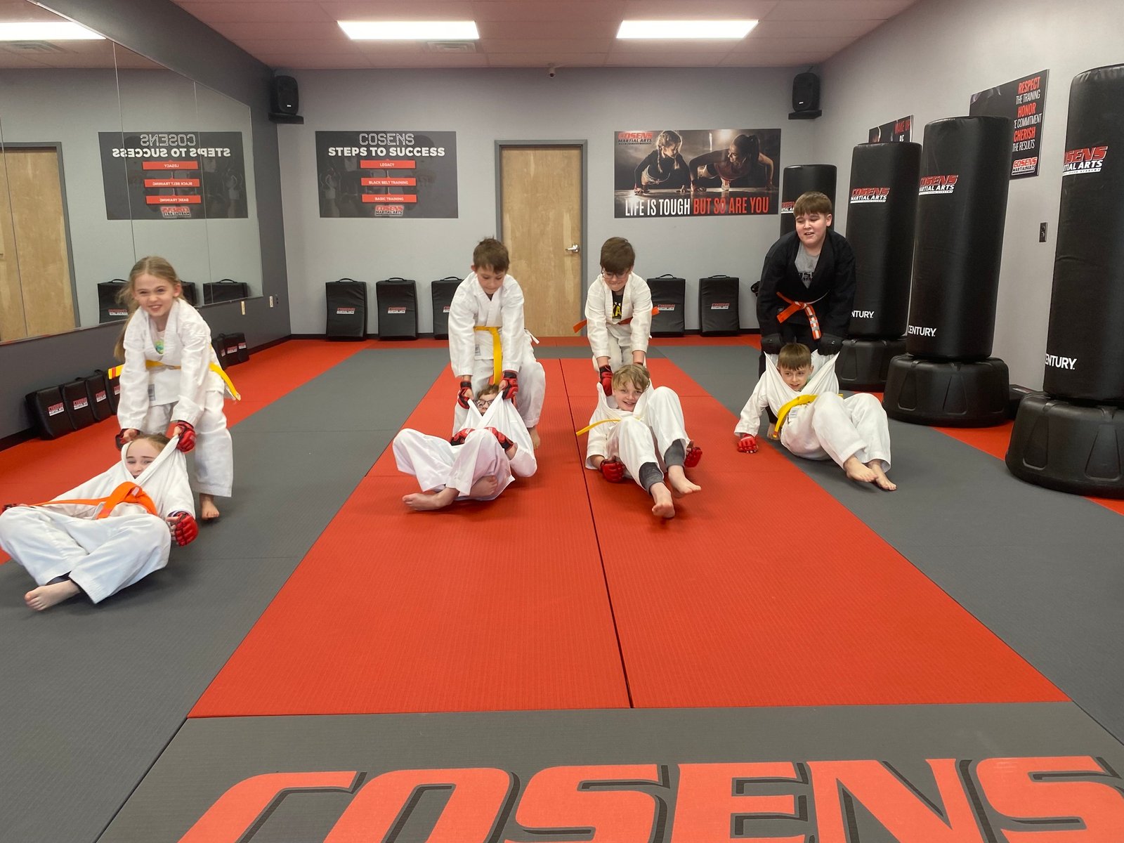 Martial arts class in Lapeer teaching kids how to share and cooperate