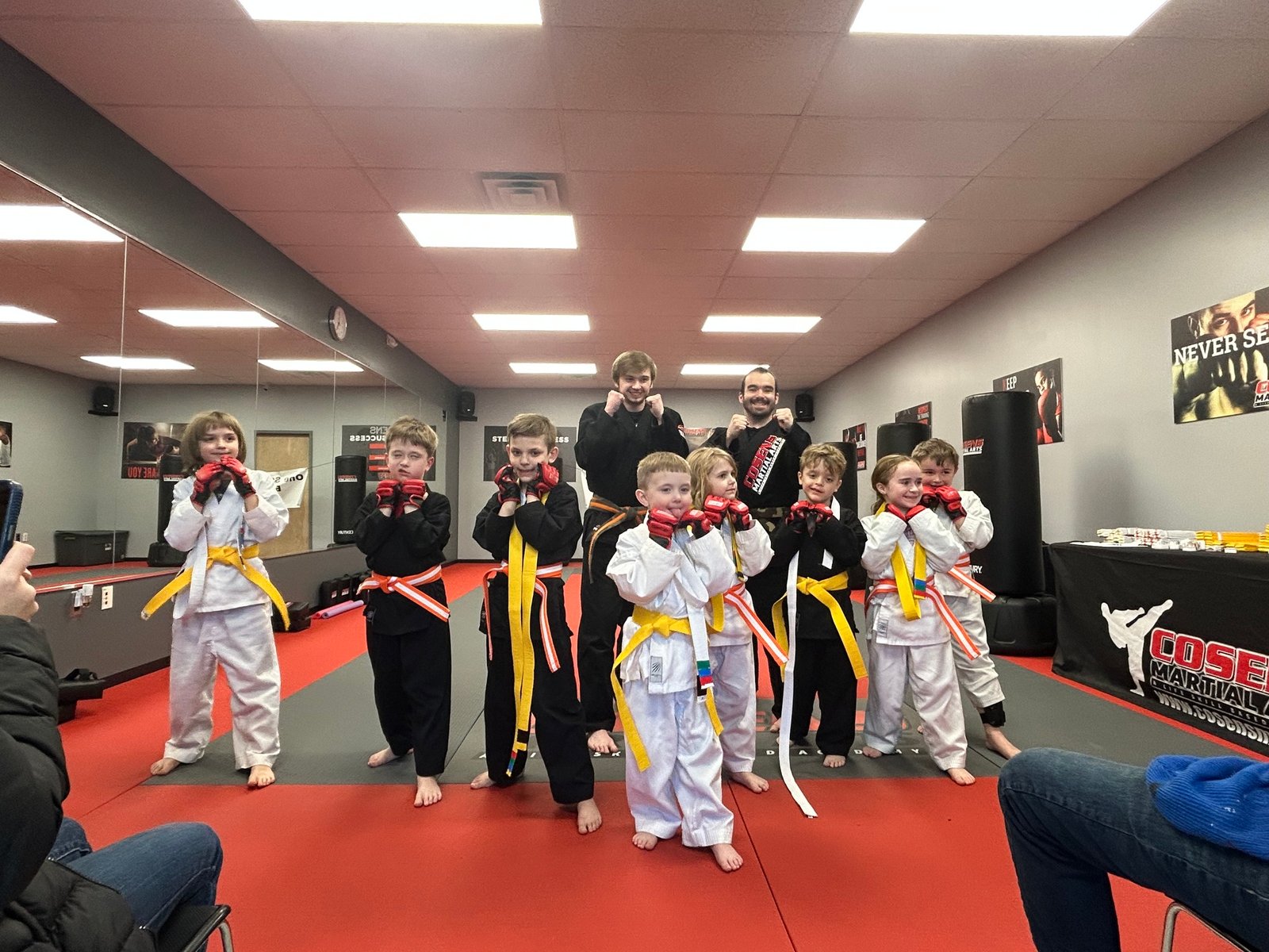 Children working in pairs during martial arts class in Lapeer