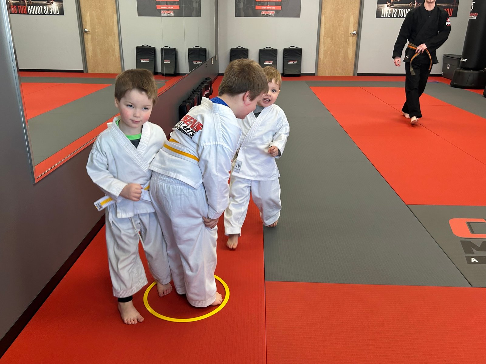 Children in Lapeer martial arts class working together