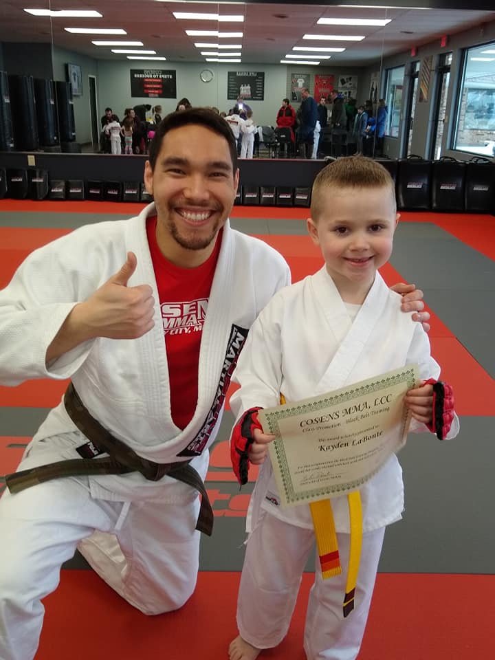 Little Ninjas martial arts student with a coach