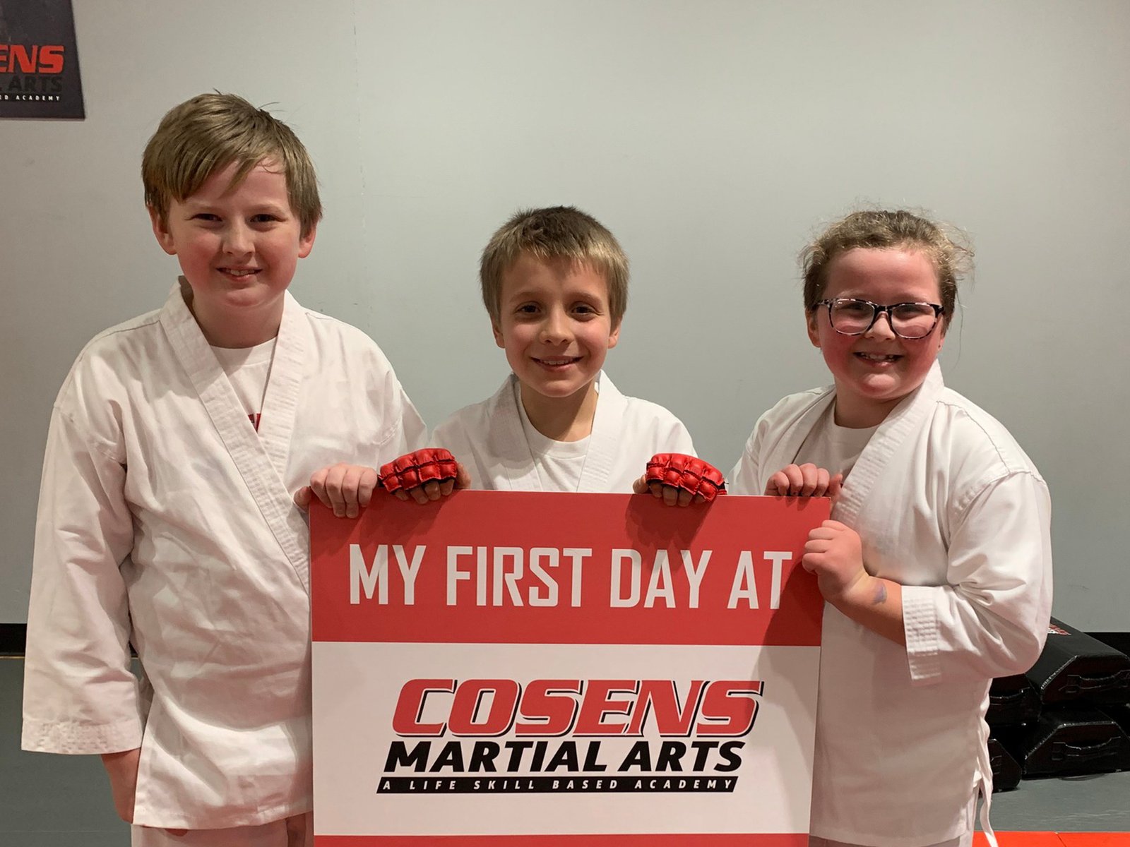 New martial arts students smiling on their first day